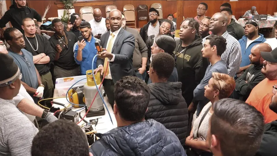 A Tauris Tech instructor demonstrating equipment to a class of students