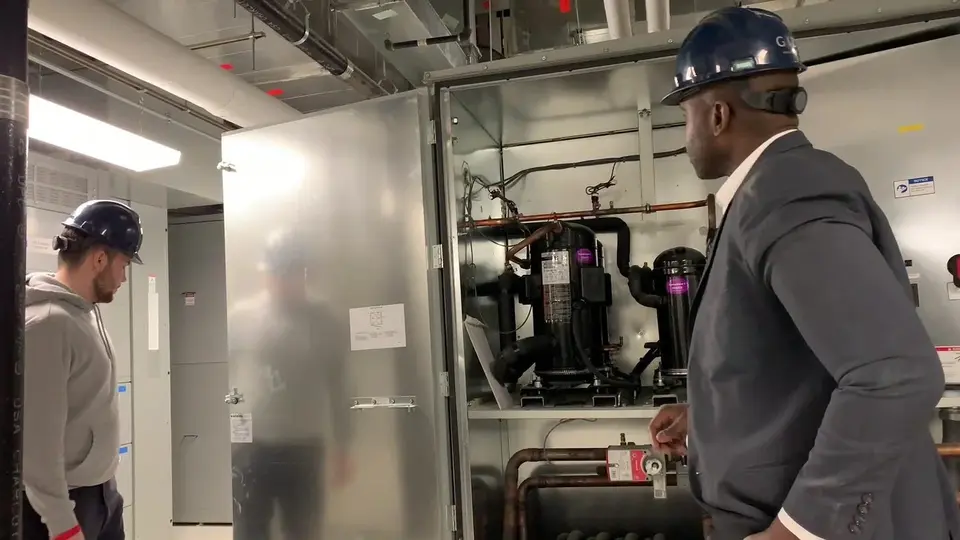 Tauris Tech students in hard hats in a New York City mechanical room