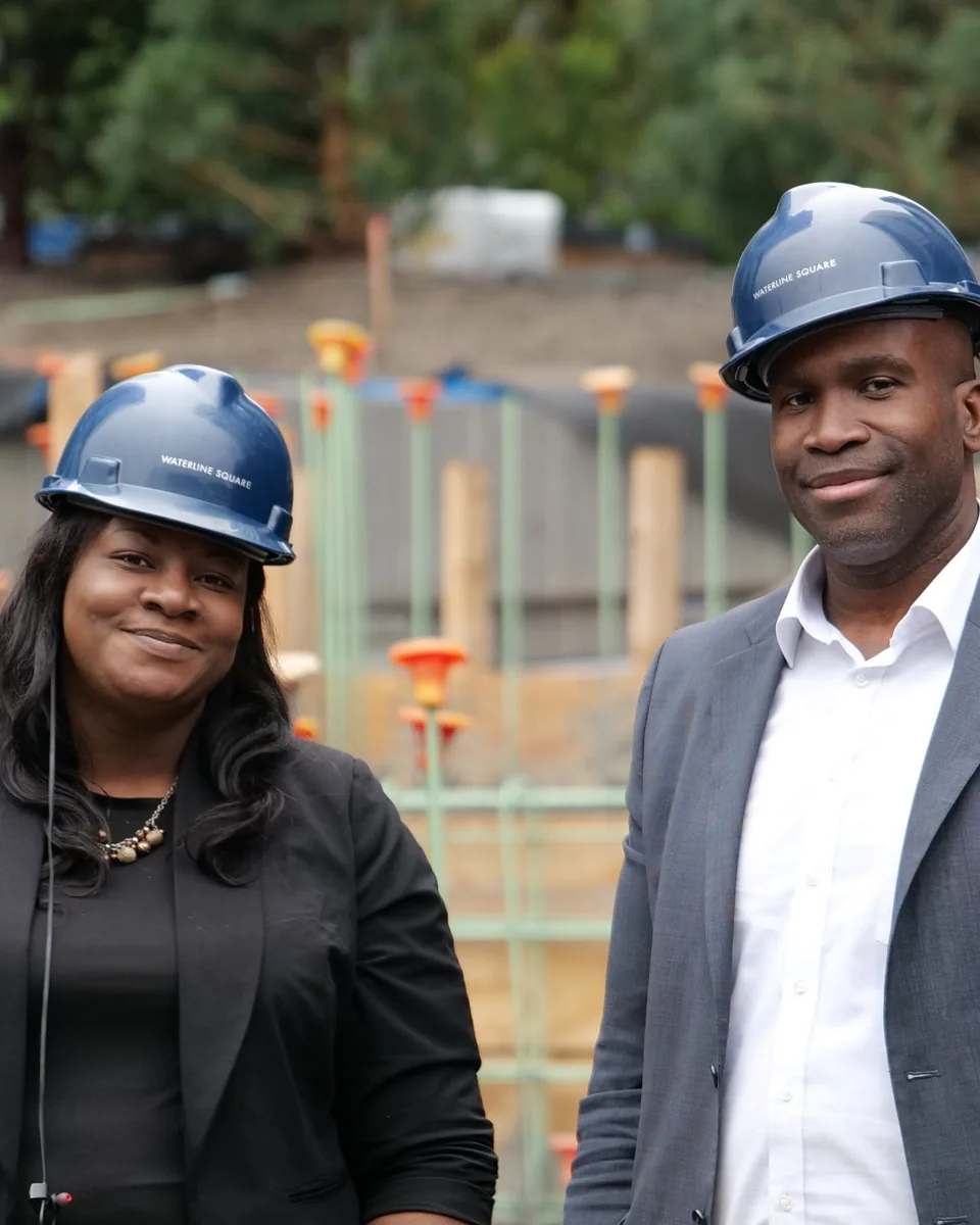 Tauris McBride and Tasheba Hamilton in hard hats at a New York City construction site